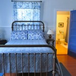 Waipio Wayside, Chinese Room, blue quilt bed with bathroom in background